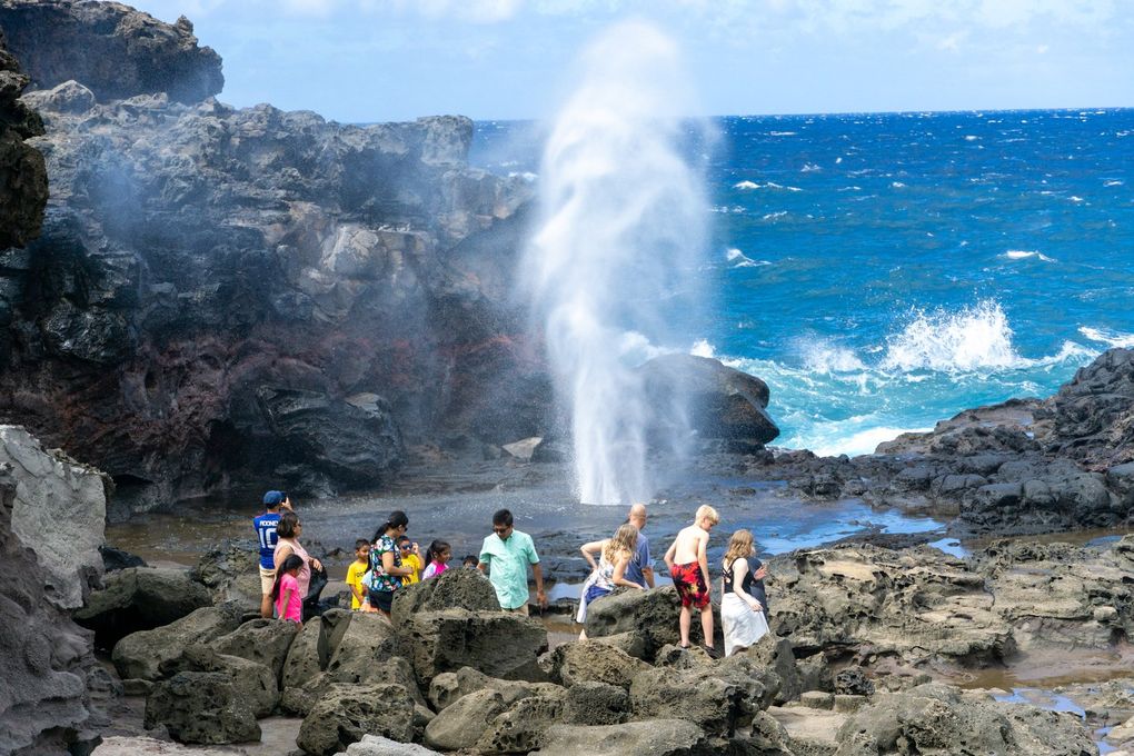 Visitors enjoy the Nakalele Blowhole in Hawaii in July. Don’t get too close — the blowhole can easily suck a person in.  (Colleen Stinchcombe / Special to The Seattle Times)