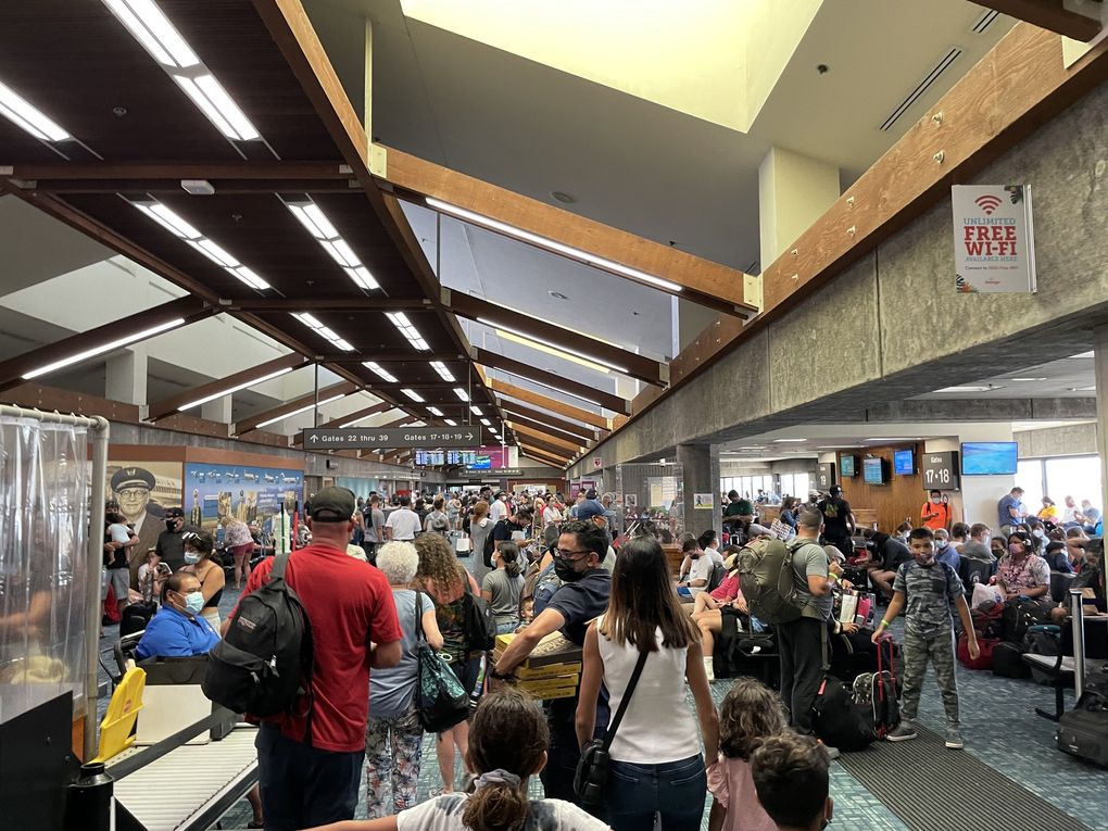 Many gates had standing room only as tourists tried to fly home from Hawaii last month at Maui Kahului Airport.  (Colleen Stinchcombe / Special to The Seattle Times)