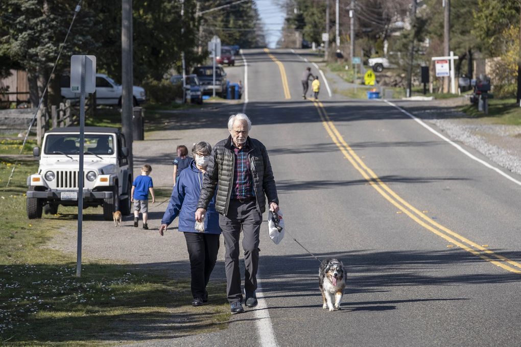 More sidewalks were on many wish lists. Here, Garry and Joyce Lingerfelt walk in Shoreline in 2020. (Dean Rutz / The Seattle Times)