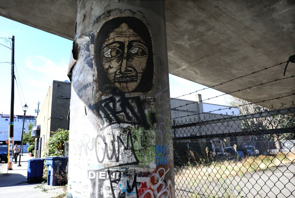 Graffiti Rangers generally do not cover posters like these, put on an onramp support pole in Georgetown. (Alan Berner / The Seattle Times)