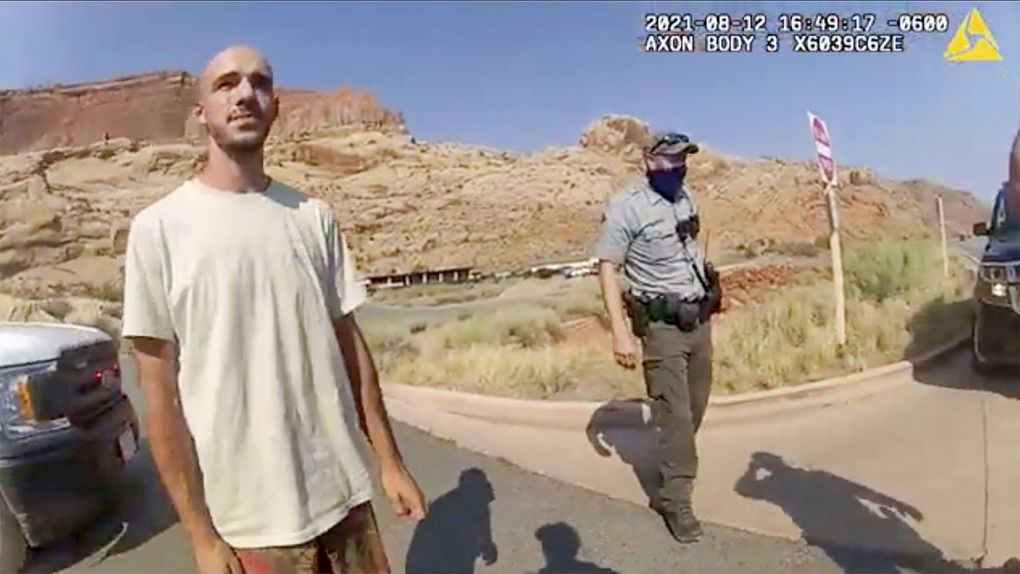 Brian Laundrie talks to a police officer after police pulled over the van he was traveling in with his girlfriend, Gabrielle “Gabby” Petito, near the entrance to Arches National Park on Aug. 12. The couple was pulled over while they were having an emotional fight. (The Moab Police Department via AP)