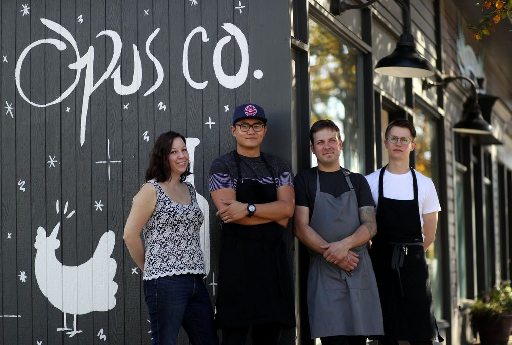 Opus Co. had a small staff that included, from left, Corynn Youderian, Paolo Campbell, owner Mark Schroder and Carl Mofjeld. The restaurant has shut down. (Erika Schultz/The Seattle Times)