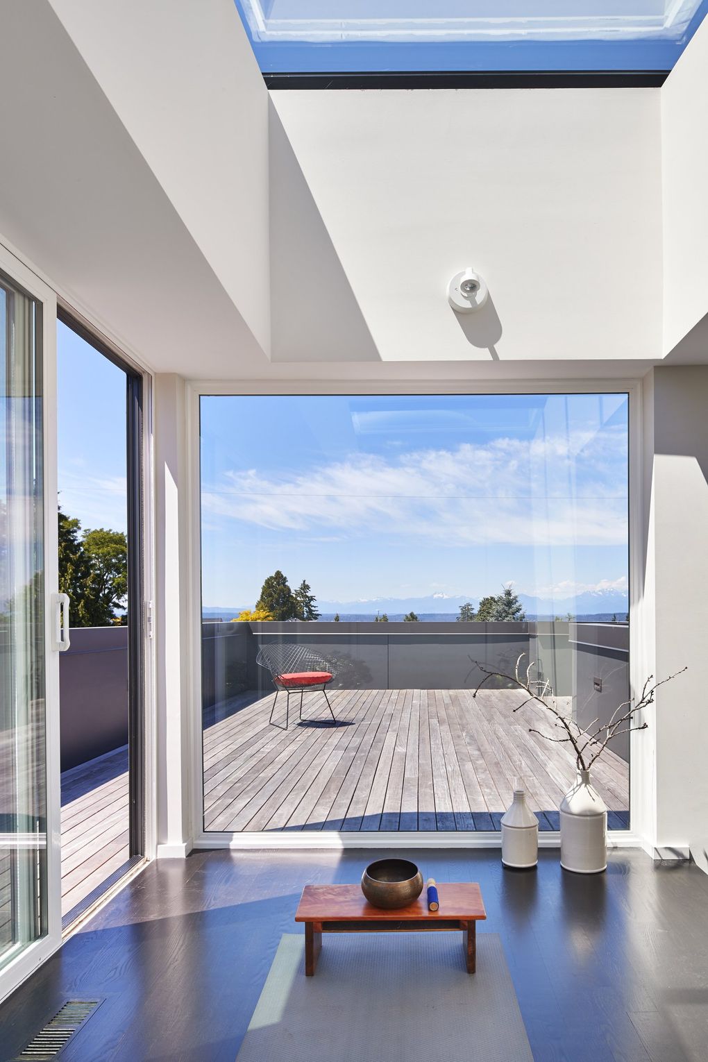 Up on the rooftop of this modern home in Magnolia designed by Jill Rerucha of ReruchaStudio (the builder was Mint Build), a super-roomy yoga studio pops up atop a view-perfect deck. (Benjamin Benschneider / The Seattle Times, 2016)