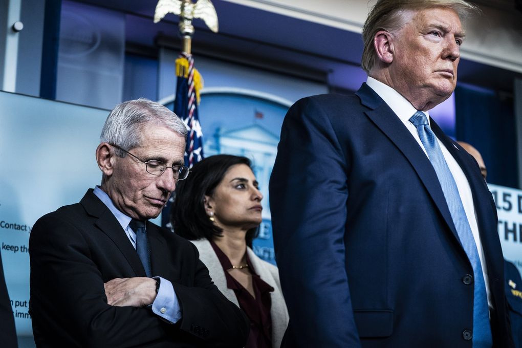 Anthony Fauci listens as President Donald Trump announces on March 16, 2020 that the virus outbreak could last for months.  (Jabin Botsford / Washington Post)
