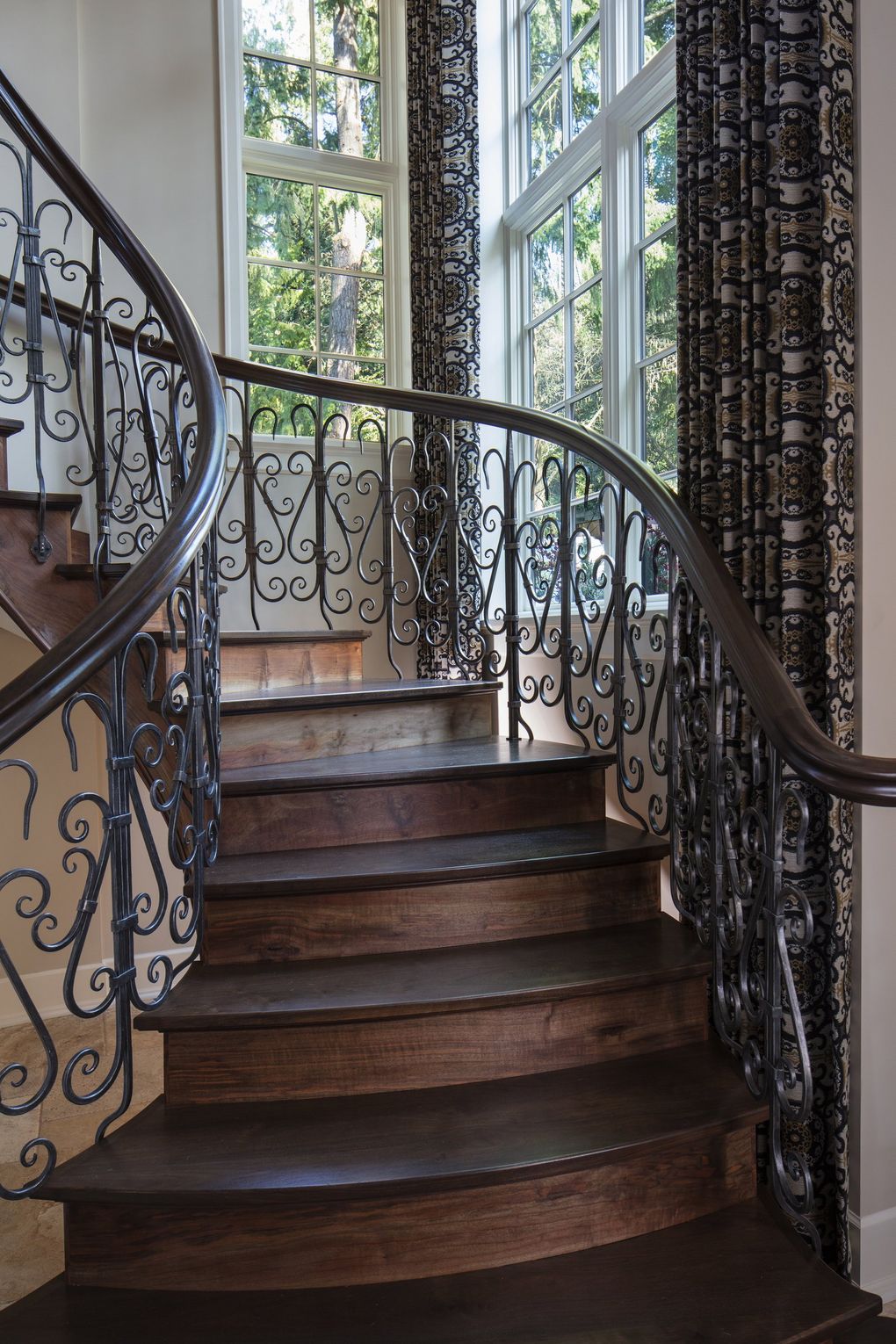 The entry stairway in this stone home on Lake Washington “started from a picture of a staircase in the Fairmont Olympic Hotel,” says architect Tom Kuniholm. “Nathie (Katzoff, of NK Woodworking & Design) did the sketches, fabricated and tooled it. He had to make each piece differently, the curve is so tight.” (Steve Ringman / The Seattle Times, 2017)