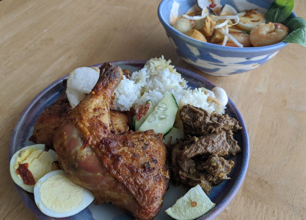 Kirkland’s Reunion specializes in Malaysian fare, like big bowls of seafood laksa and chili-rubbed roast chicken and lemon grass beef.  (Jackie Varriano / The Seattle Times)