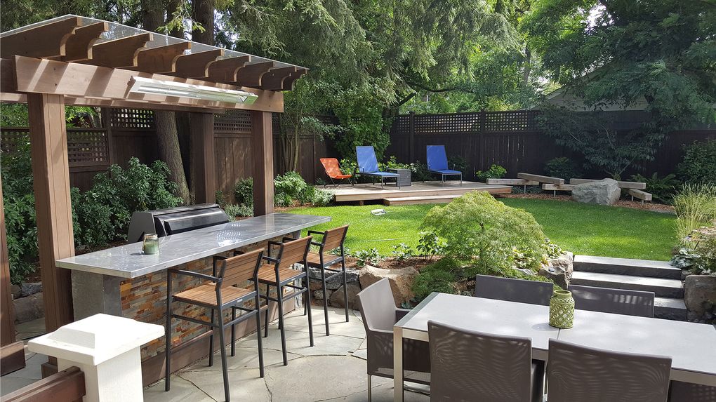 Lisa Port’s company, Banyon Tree Design, put together this Seattle backyard, which includes a partially covered outdoor kitchen and several places to sit comfortably. (Courtesy of Lisa Port)
