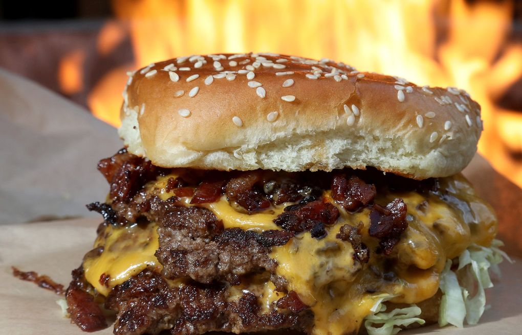 Double cheeseburger, Burb’s Burgers: The smoky burgers here are sizzled on the grill until the edges form a thick, charred crust. Tasty, and cheap. (Greg Gilbert / The Seattle Times)