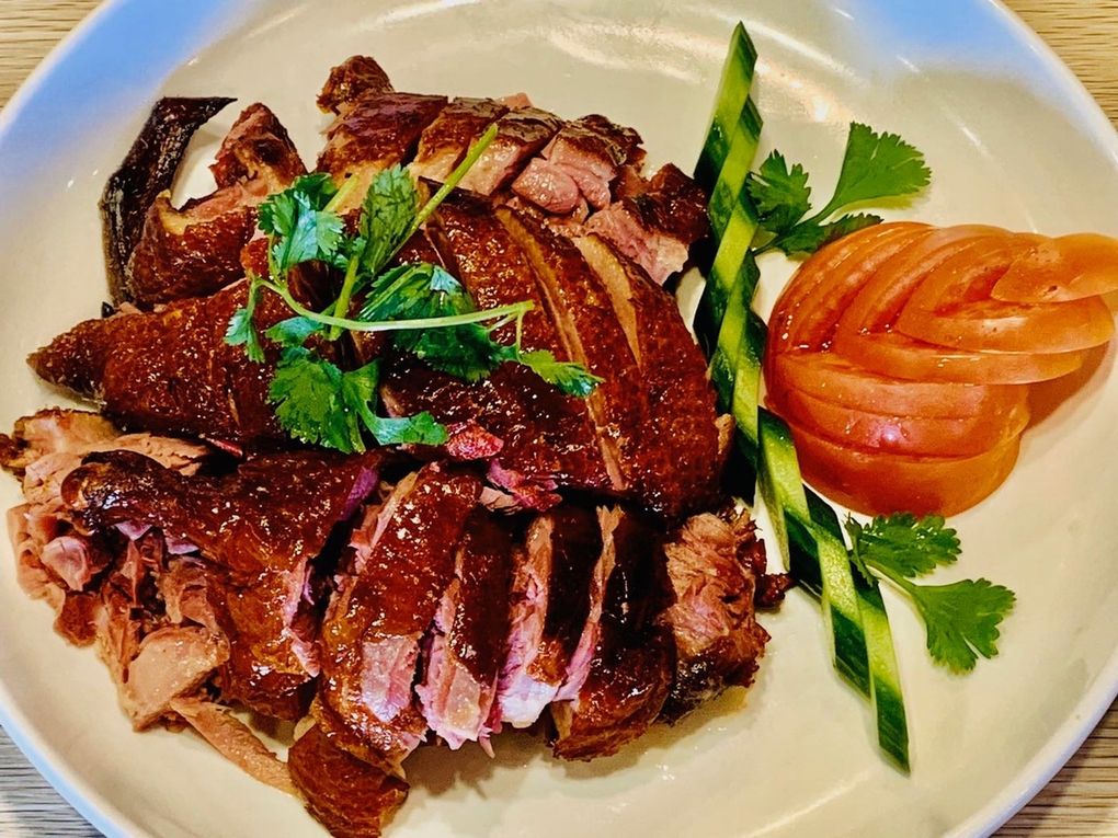 Tea-smoked duck, Dan Gui Sichuan Cuisine: The meat for this great dish is smoked in green tea leaves and jasmine flowers. (Courtesy Dan Gui Sichuan Cuisine)