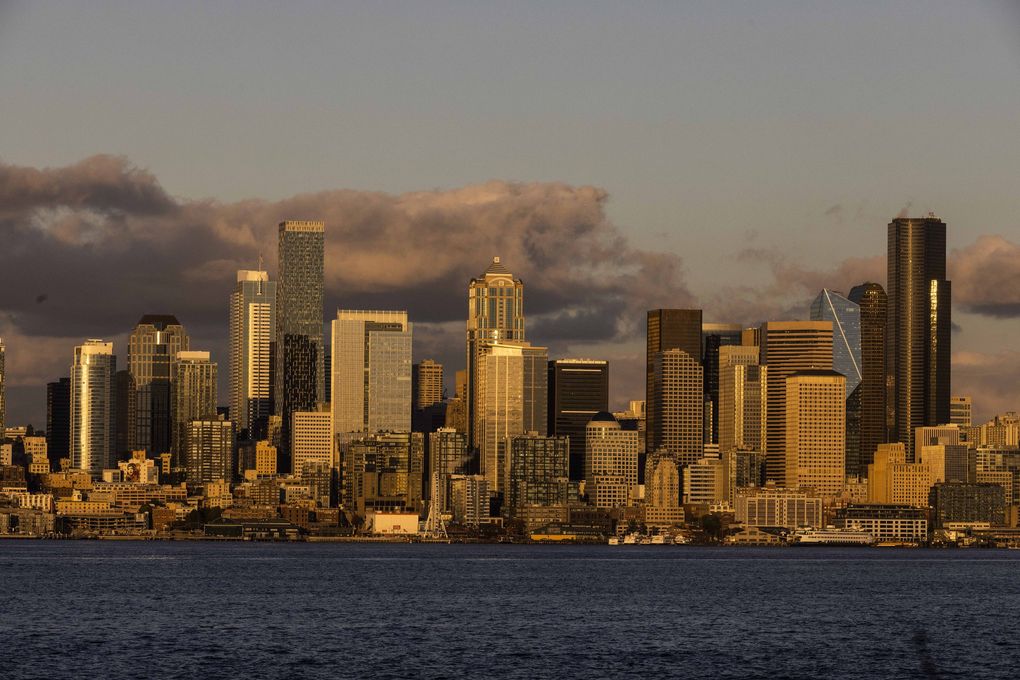 The sun sets on the Seattle skyline on October 11 Daniel Kim / The Seattle Times