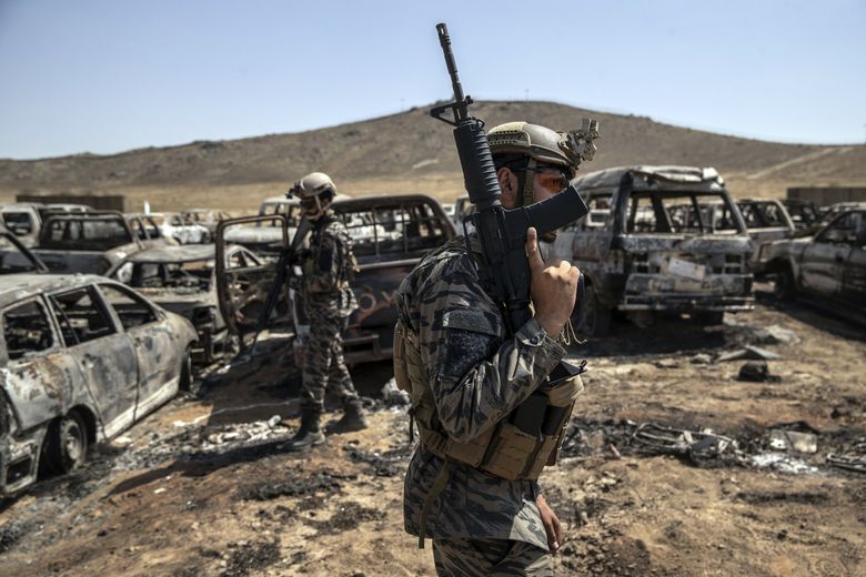 Members of the Taliban 313 Badri Unit, with American weapons, patrol a former CIA base in Kabul on Sept. 6, 2021. The Taliban seized troves of American weapons and vehicles from surrendering Afghan soldiers. (Victor J. Blue / The New York Times)