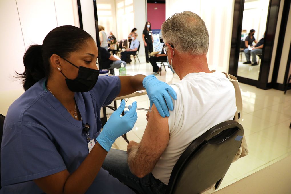 A medical worker administers a COVID-19 booster vaccine in San Rafael, Calf., on Sept. 29, 2021. The FDA is planning to allow Americans to receive a different COVID-19 vaccine as a booster than the one they initially received, a move that could reduce the appeal of the Johnson & Johnson vaccine and provide flexibility to doctors and other vaccinators. (Jim Wilson / The New York Times)