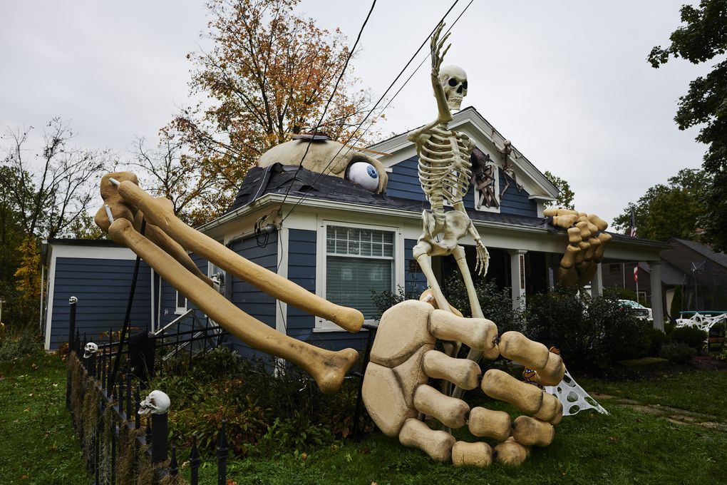 Skeletons and other Halloween decorations fill the yard in front of Alan Perkins’s home in Olmsted Falls, Ohio, on Oct. 22. (Photo for The Washington Post by Angelo Merendino)
