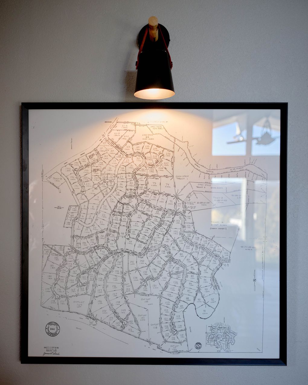 A map of Paradise Hills, showing the location of its 185 homes, hangs in Michele Lawrence’s house. She opposed the camera installation. (Photo by Stephen Speranza for The Washington Post)