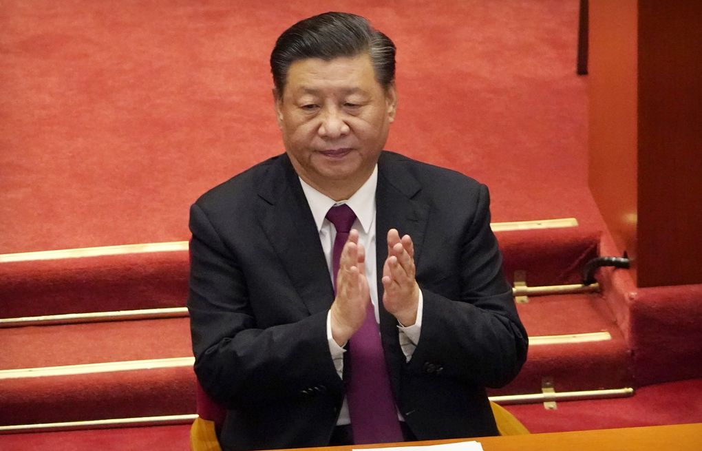 Chinese President Xi Jinping applauds during the closing session of the Chinese People’s Political Consultative Conference (CPPCC) at the Great Hall of the People in Beijing, Wednesday, March 10, 2021. Xi is expected talk to global leaders at the U.N. climate summit in Glasgow, Scotland, by video link, the foreign ministry announced Friday, Oct. 29, 2021. (AP Photo/Mark Schiefelbein, File) BKWS301 BKWS301
