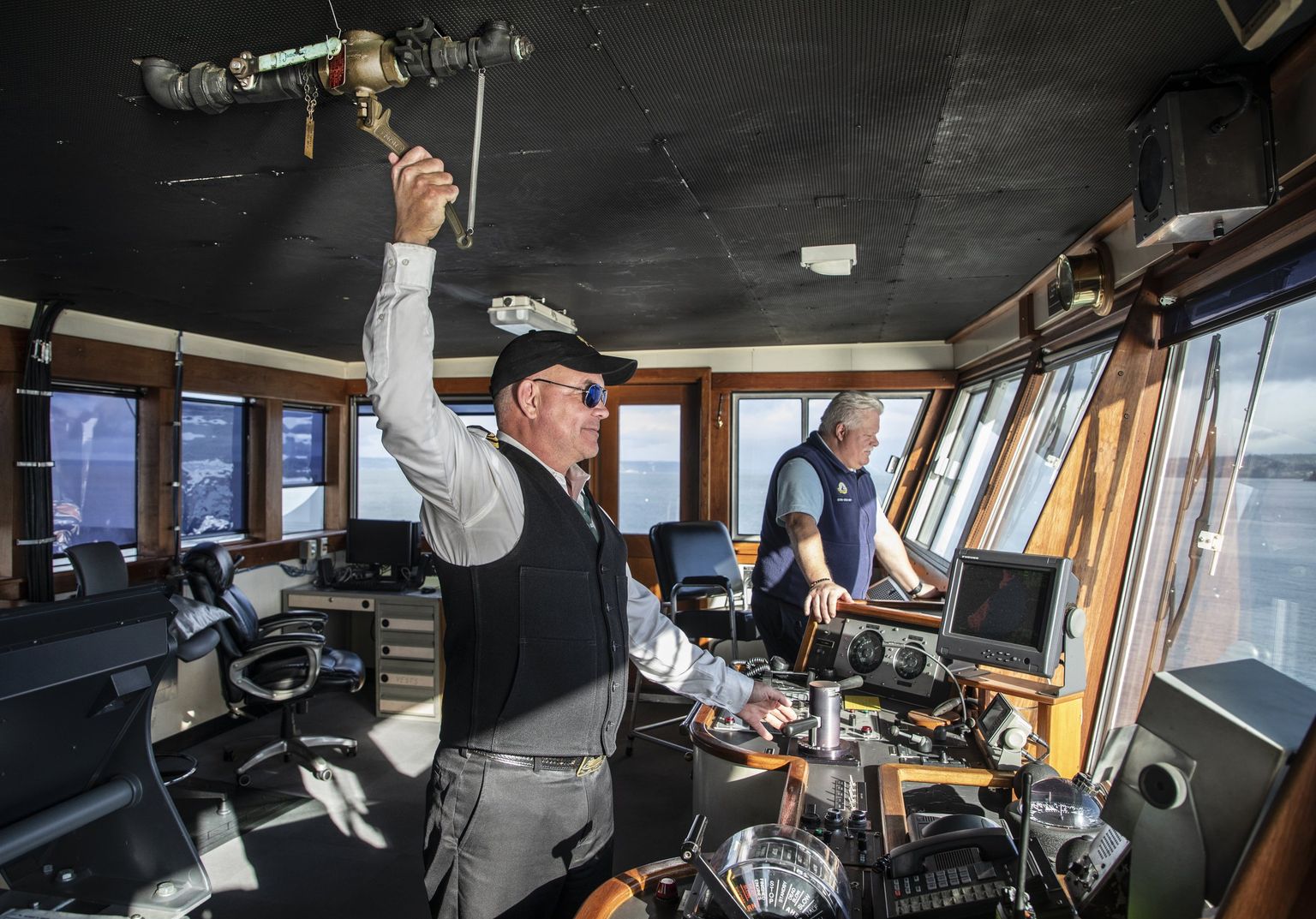 Capt. Alex Johnson blows the horn as M/V Kaleetan approaches the Edmonds ferry dock.