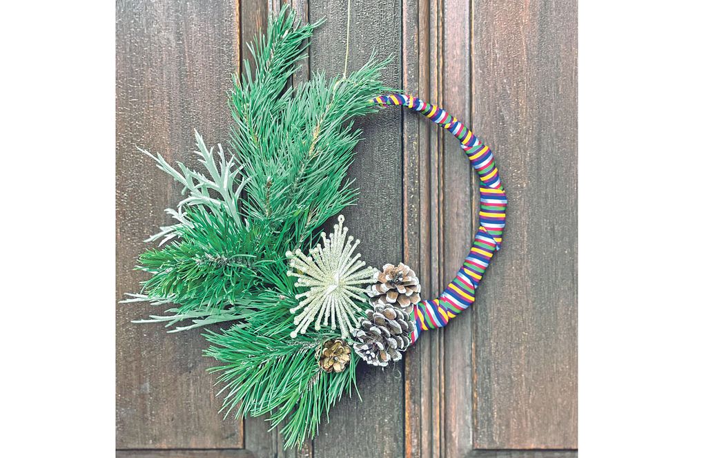 Outdoor decorations can create a welcoming vibe for holiday guests. Sunny Hong likes to weave ribbons of colorful Korean Saekdong fabric into Christmas wreaths for her front door. (Courtesy of Portmanteau Home)