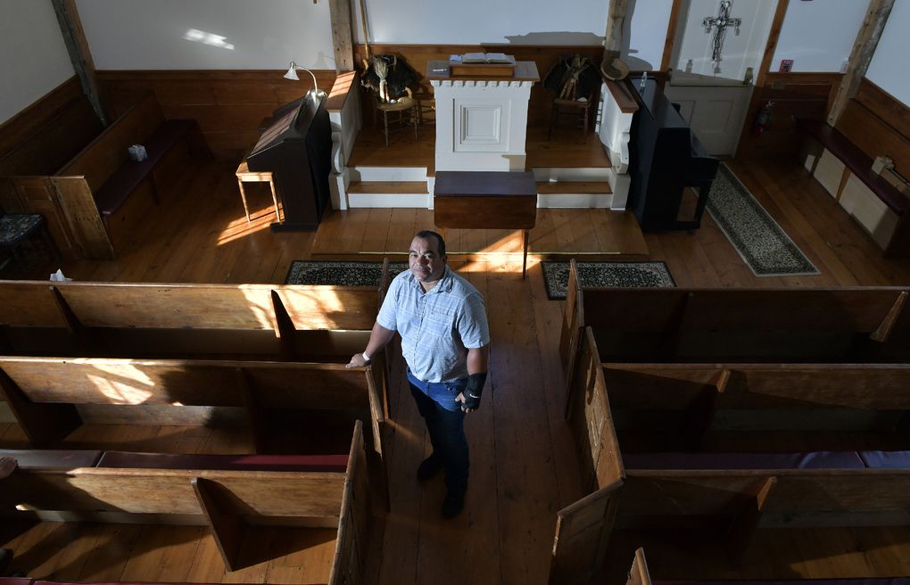 Darius Coombs, a Mashpee Wampanoag who serves as the tribe’s cultural and outreach coordinator, stands in the old Indian Meeting House in Mashpee, Mass., on September 29, 2021. (Photo for The Washington Post by Josh Reynolds).